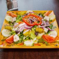 Mediterranean Salad · Garden fresh wedges of tomatoes, olives, imported feta cheese, hard-boiled egg, cucumbers, o...