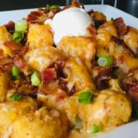 Loaded Spuds · Choice of seasoned waffle fries, beer battered fries, or tater tots. Covered in melted jack-...