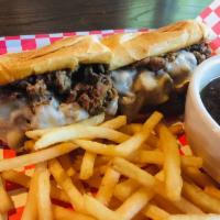 French Dip Sandwich · Over a half pound of shaved premium roast beef, melted provolone, mayo, and au jus for dippi...