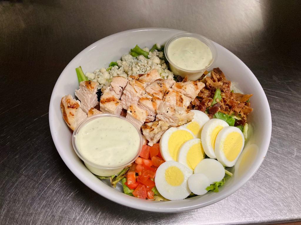 Chicken Cobb Salad · Mixed greens, bacon, tomatoes, boiled egg, and bleu cheese crumbles. We recommend Avocado Ranch or House Ranch dressing