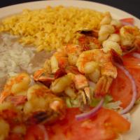 Camarones a la Plancha Combo · Grilled shrimp served with rice, beans and a side of tortillas.