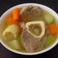 Caldo De Res · Beef soup with carrots, potato & zucchini with a side of tortillas.