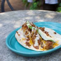 Deep South Taco · Fried chicken strips, diced avocado, applewood smoked bacon, Monterey Jack and cheddar chees...