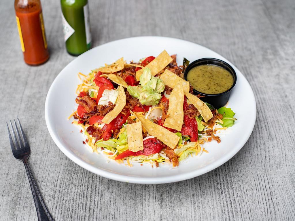 Cilantro-Lime Salad · Spring mix, romaine, sliced avocado, roasted red pepper, applewood bacon, Monterey Jack and cheddar cheese. Served with cilantro-lime vinaigrette and topped with crispy tortilla strips.