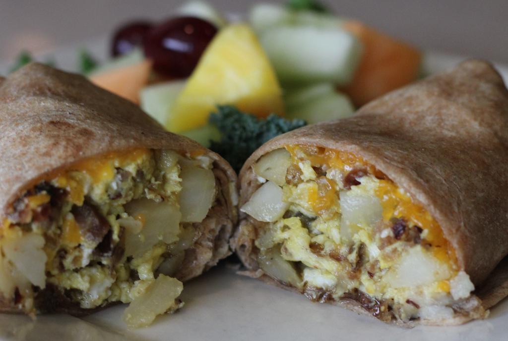 Breakfast Burrito · One of the best in OC. Two large scrambled eggs, cheddar cheese, diced potato and homemade salsa with your choice of ham, bacon, chorizo or sausage