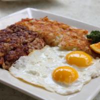 Corned Beef Hash and Eggs · Homemade corned beef hash served with two eggs, hash browns or homestyle potatoes and a choi...