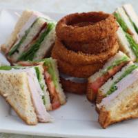 Club Sandwhich  · A triple-decker with fresh roasted turkey breast, extra-thick bacon, tomatoes, and lettuce