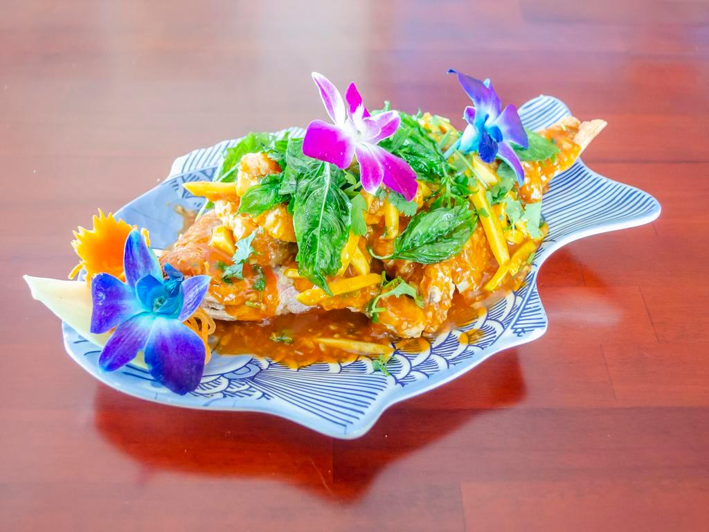 Chow Praya Tilapia · A traditionally prepared crispy tilapia fish with Thai green curry paste bamboo shoots, coconut milk, and basil. Choice of fillet or whole fish.