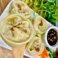 Dumplings (Steamed or Fried) · Stuffed with mixed vegetables; drizzled with fried garlic. Served with a side of vinaigrette...