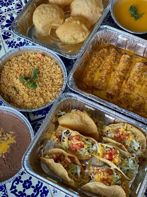 No. 6 Family Style · Feeds up to 6. Classic Cheese Enchiladas, Crispy Beef Tacos, Puffy Quesos. Served with Mexican Rice, Choice of Beans and Chips & Salsas.