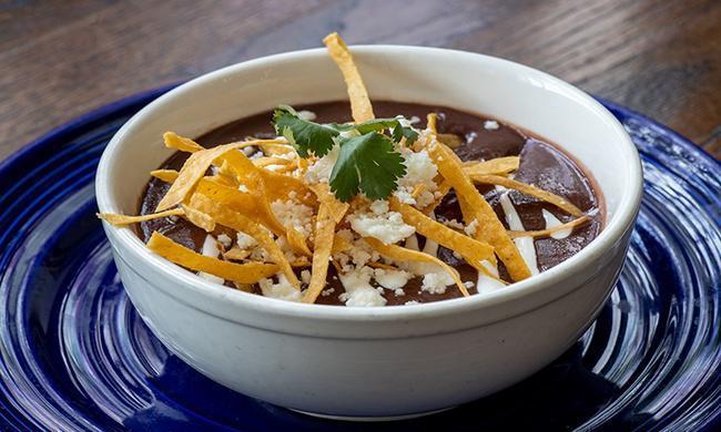 Black Bean Soup · Black beans, Mexican crema, cilantro, tortilla strips and queso fresco.
