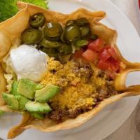 Classic Taco Salad · Crispy taco shell with chopped lettuce, taco meat, avocado, tomatoes, sour cream, & pickled ...