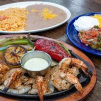 Large Shrimp Fajitas · Twelve jumbo grilled shrimp. Served with homemade tortillas, Mexican Rice, and Choice of Bea...