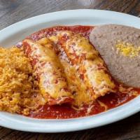 Chicken Enchilada Dinner · Corn tortillas rolled with shredded taco chicken & topped with your choice of sauce.