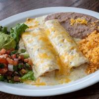 Shrimp Enchilada Dinner · Two shrimp enchiladas topped with cream sauce & melted cheese. Served with guacamole & pico ...