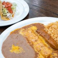 Tampico Dinner · Crispy Beef Taco, Guacamole Salad, Cheese Enchilada, and Tamale topped with Chili Gravy. Ser...