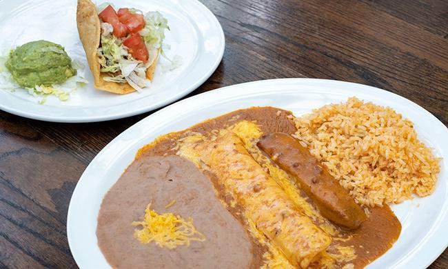 Laredo Dinner · Crispy Beef Taco, Guacamole Salad, Cheese Enchilada, and Tamale topped with Chili Gravy. Served with Mexican Rice and beans.