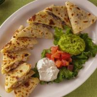 Chicken Quesadilla · Grilled Chicken Quesadillas made with homemade tortillas and melted cheese. Served with dice...