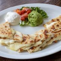 Cheese Quesadilla · Cheese Quesadillas made with homemade tortillas and melted cheese. Served with diced tomatoe...