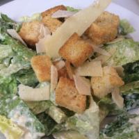 Homemade Caesar Salad	 · Fresh romaine lettuce carefully folded into our own homemade Caesar dressing. Topped with sh...