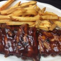 Baby Back Ribs · Slow-cooked, making the end result a rack of ribs that is tender and mouth-watering. Served ...