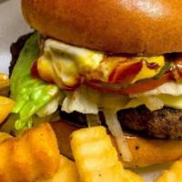 Cheeseburger · 100 percent ground beef served with cheese, lettuce, tomato, grilled onions, pickles, ketchu...