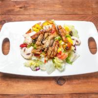 Grilled Chicken Salad Parmesan · Grilled chicken with parmesan cheese served on lettuce with tomatoes, onions, mushrooms, var...