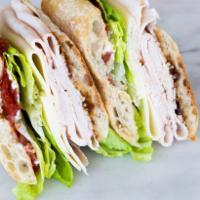 Turkey Provolone Sandwich · Roasted turkey breast with Boar's Head provolone cheese, leaf lettuce, roasted tomatoes, fin...