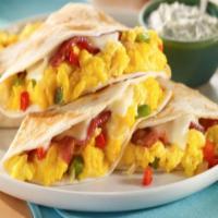 Breakfast Quesadilla  · choose scrambled eggs, ham and cheese or scrambled eggs, cheese and chorizo