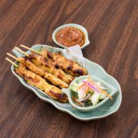4 Piece Satay Chicken · Grill and skewered chicken marinated with cucumber salad and peanut sauce.