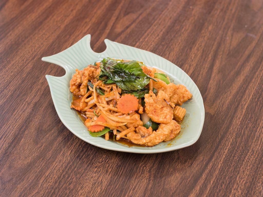 Pad Ped Catfish Stir Fried · Stir-fried catfish with red curry plate, onions, bamboo shoots, bell pepper, mushroom, carrots, basil leaves, eggplant, baby corn and peapod.