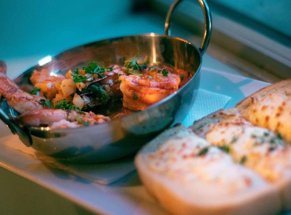 Gambas  · Spanish style garlic shrimp with smoked paprika, served with toasted cheesy sourdough bread.