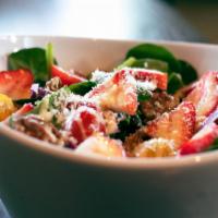 Garden Spinach Salad  · Strawberries, cherry tomatoes, red onions, Gorgonzola, candied pecans with a honey-Dijon vin...