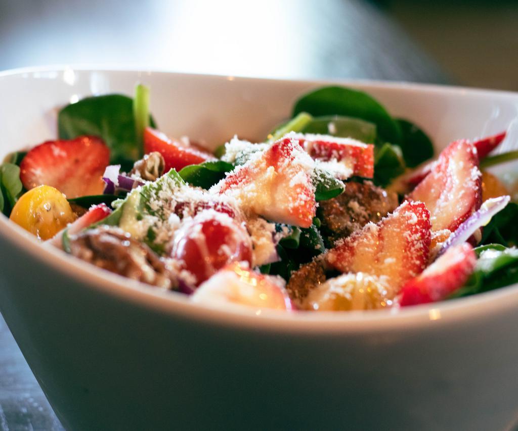 Garden Spinach Salad  · Strawberries, cherry tomatoes, red onions, Gorgonzola, candied pecans with a honey-Dijon vinaigrette.