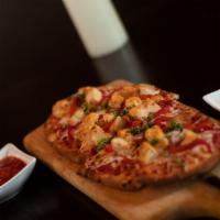 Grilled Chicken Flatbread Pizza  · Smoked Gouda, house marinara, mozzarella, Parmesan-Romano cheese, red onions and roasted red...