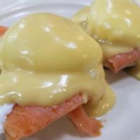 Eggs Julia Benedicts · Smoked salmon. Poached eggs on toasted English muffin and topped with hollandaise sauce.