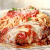 Chicken Parmesan · Lightly breaded chicken cutlets, topped with tomato sauce and melted mozzarella cheese. Serv...