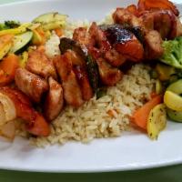 Chicken Kebob · Tender chunks of chicken with peppers and onions char grilled on a skewers. Served over rice...