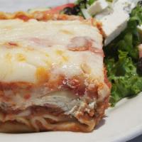 Lasagna · Classic Italian recipe, layers of flat pasta, in house meat sauce, mozzarella and ricotta ch...