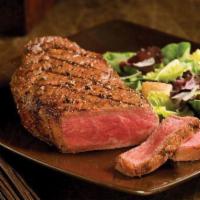 New York Strip · 14 oz. prime cut served with mashed potatoes and mixed vegetables.