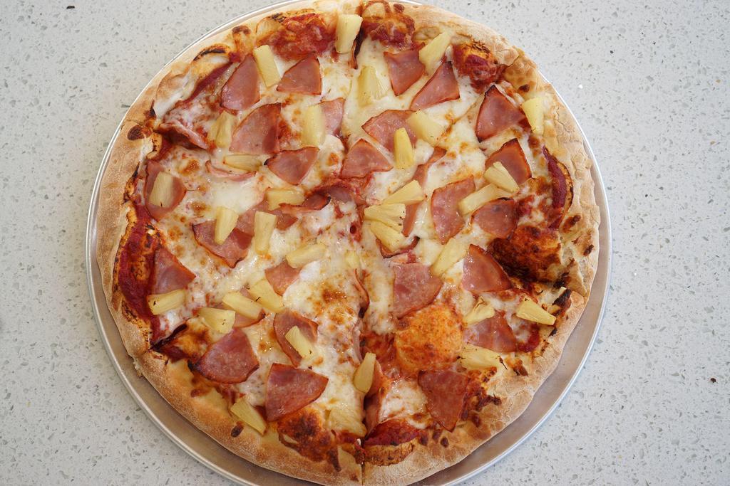 Hawaiian Pizza · Red sauce, cheese, ham and pineapple.