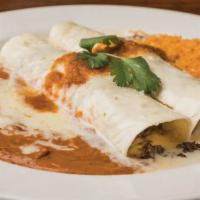 Dos Amigos Burrito · 2 ground beef burritos topped with salsa ranchera and queso blanco. Served with Mexican rice...