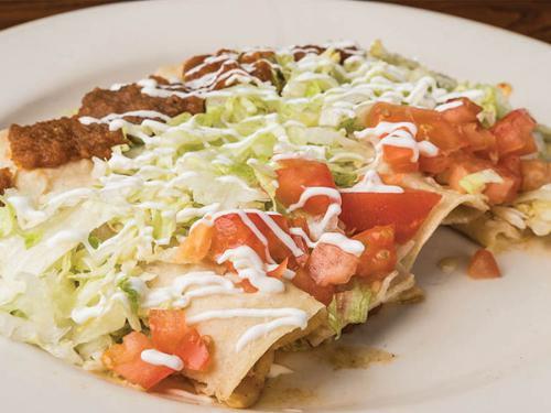 4 Primas Enchilada · 1 each chicken, bean, beef and cheese enchiladas topped with lettuce, tomato, sour cream and salsa ranchera.