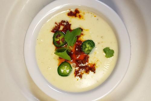Queso con Chorizo · Delicious queso blanco with a burst of flavorful chorizo (Mexican sausage) and a hint of jalapeno.