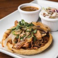 2 Carnitas Sopes · Pulled pork carnitas from Abuela's own traditional recipe, topped with fresh cilantro, caram...