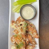 Wings · Roasted jumbo drumsticks and flats fried crispy with 8 to an order. Choice of house-made buf...