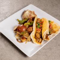 Breakfast Tacos · 2 flour tortillas filled with scrambled eggs, bacon or chorizo sausage and shredded cheese s...