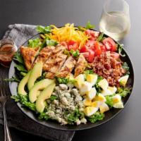 Chopped Cobb Salad · Grilled chicken, crispy bacon, avocado, diced egg and tomatoes with bleu cheese crumbles and...