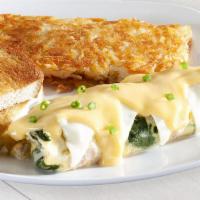 Florentine Omelette · Fresh spinach, ham, onions, Swiss cheese, hollandaise and green onions.			
