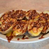 BBQ Chicken Potato Skins · Topped with cheddar and Jack cheese, chopped BBQ chicken breast and bacon, served with 2, 2o...